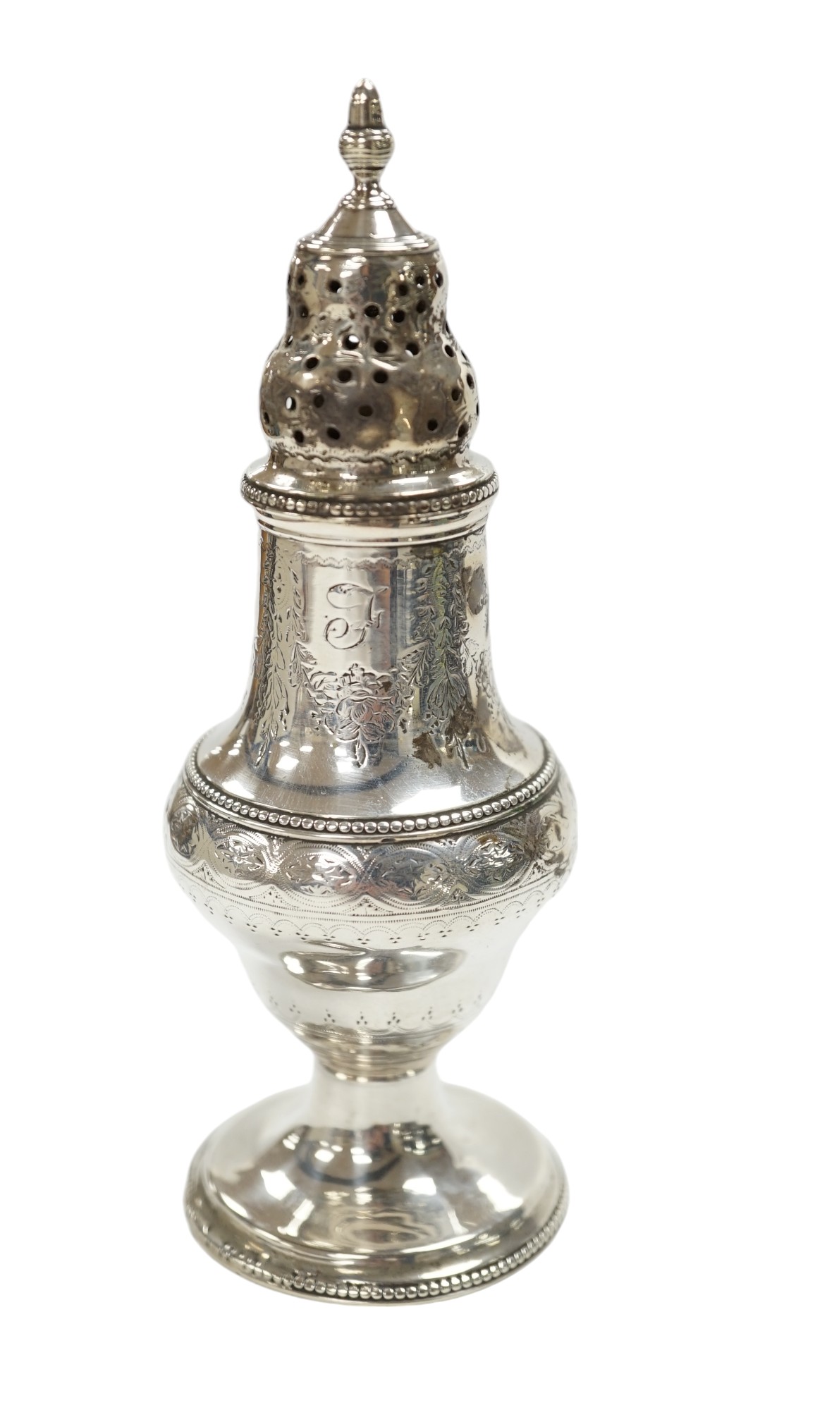 A George III silver baluster pepperette, Thomas Daniell, London, 1785, 14.6cm. Condition - poor